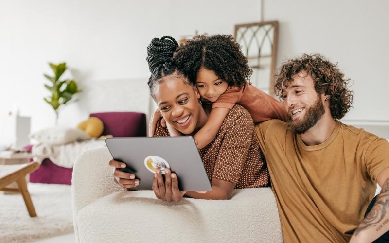 a man and woman looking at a tablet